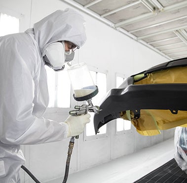 Collision Center Technician Painting a Vehicle | Matick Toyota in Macomb Township MI