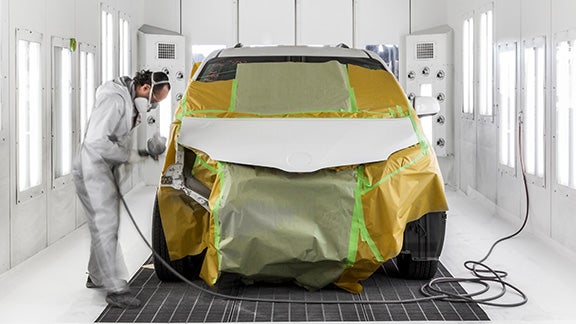 Collision Center Technician Painting a Vehicle | Matick Toyota in Macomb Township MI