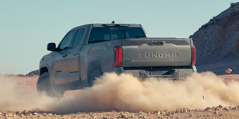 2024 Toyota Tundra driving through a dirt road - Matick Toyota in Macomb Township MI