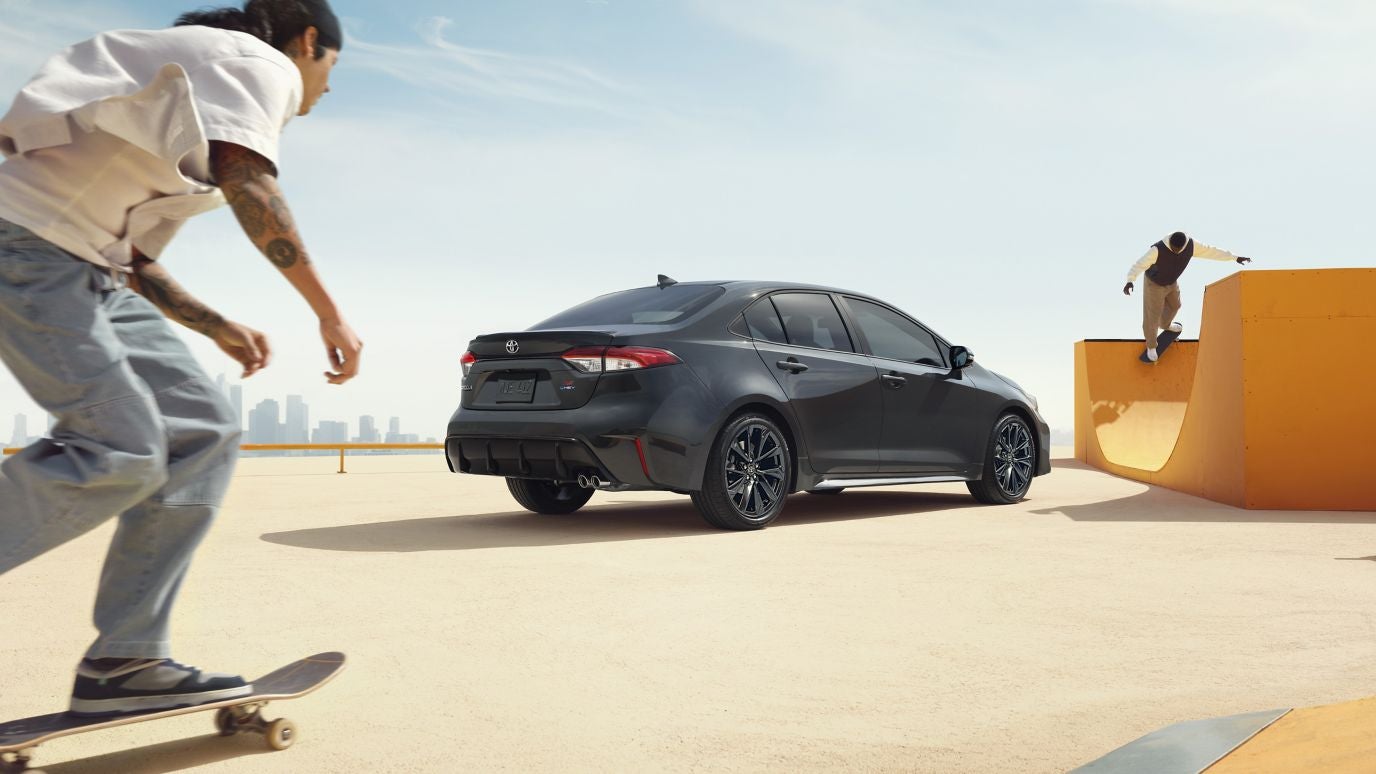 A dark grey 2026 Toyota Corolla at a skate park